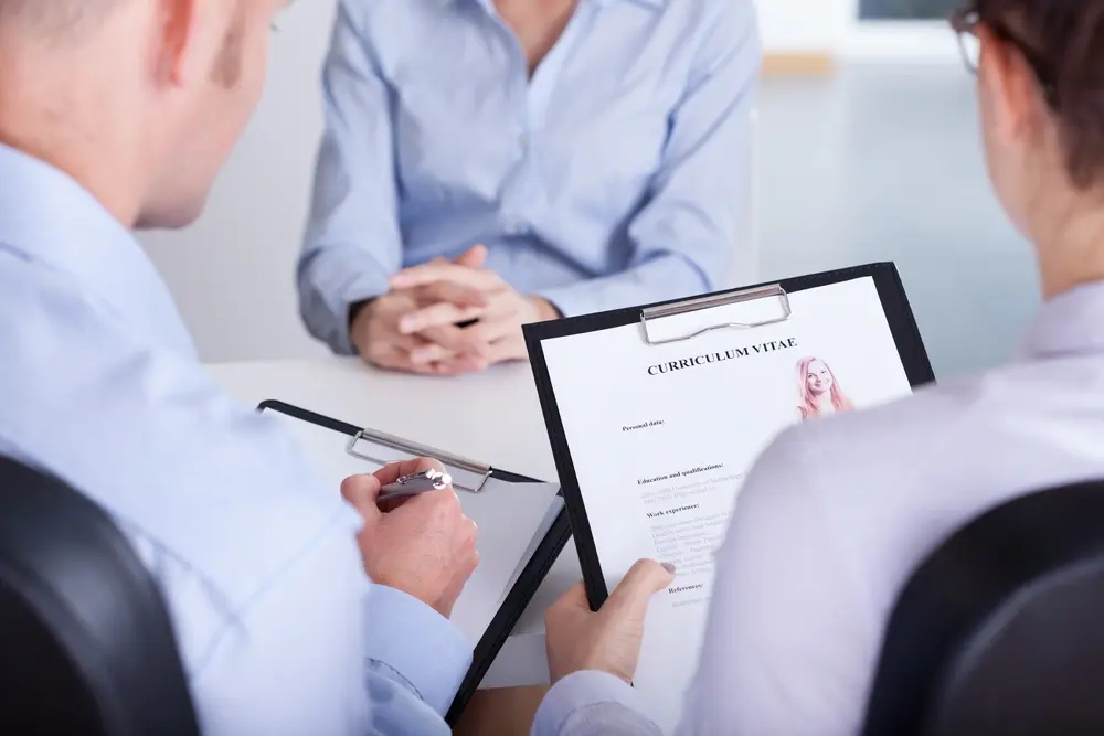 Two employers checking curriculum vitae of new candidate_compressed